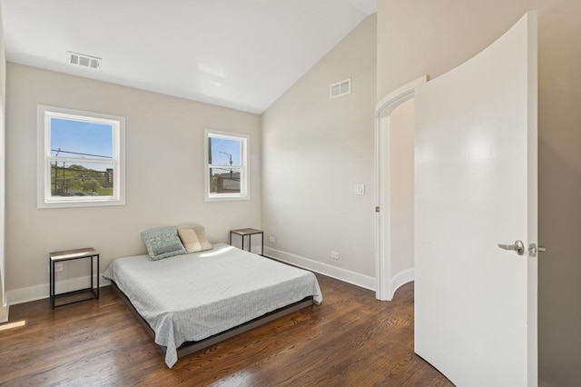 2415 W Washburne Ave, Chicago, IL 60608 - bedroom with vaulted ceiling, baseboards, and dark wood-style flooring