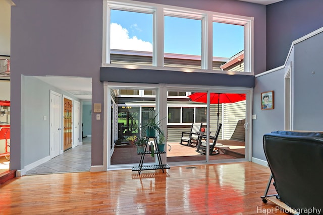 1504 N Denali Trl, Mchenry, IL 60050 - exercise room with a high ceiling, wood-type flooring, and plenty of natural light