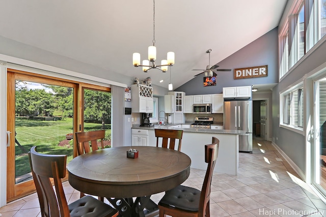 1504 N Denali Trl, Mchenry, IL 60050 - dining area with light tile patterned floors, a chandelier, plenty of natural light, high vaulted ceiling, and a ceiling fan