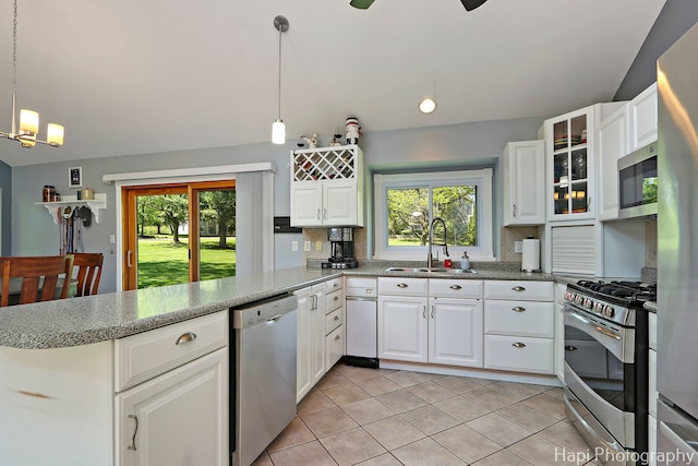 1504 N Denali Trl, Mchenry, IL 60050 - kitchen featuring stainless steel appliances, a peninsula, a sink, and white cabinets