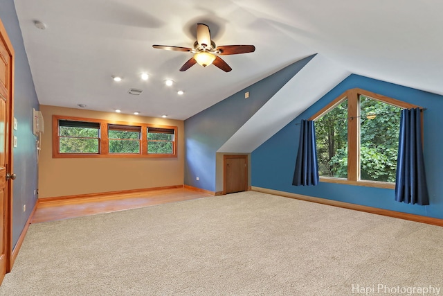 1504 N Denali Trl, Mchenry, IL 60050 - additional living space with carpet floors, healthy amount of natural light, a ceiling fan, vaulted ceiling, and baseboards