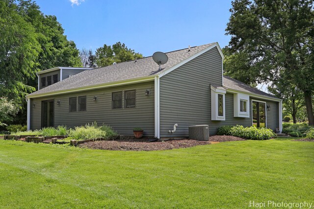 1504 N Denali Trl, Mchenry, IL 60050 - view of side of home with a lawn and roof with shingles