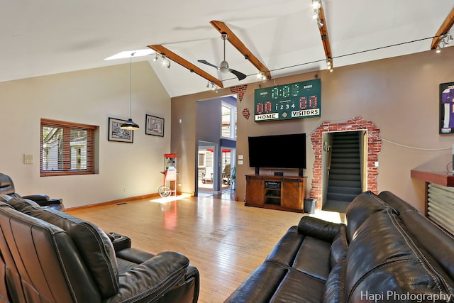 1504 N Denali Trl, Mchenry, IL 60050 - living area featuring track lighting, wood finished floors, high vaulted ceiling, baseboards, and beamed ceiling