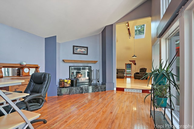 1504 N Denali Trl, Mchenry, IL 60050 - home office with hardwood / wood-style flooring, a fireplace, and high vaulted ceiling