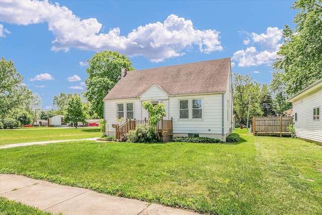 308 W Spruce St, Paxton, IL 60957 - cape cod home with a shingled roof and a front lawn