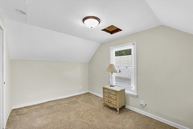 308 W Spruce St, Paxton, IL 60957 - additional living space featuring lofted ceiling, light carpet, and baseboards