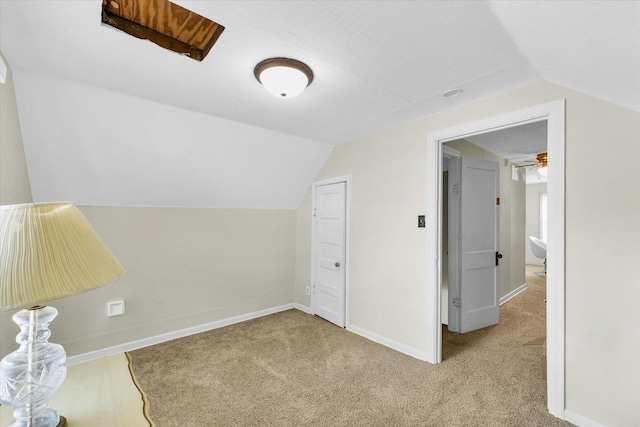308 W Spruce St, Paxton, IL 60957 - bonus room featuring lofted ceiling, carpet floors, and baseboards