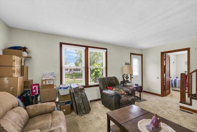 308 W Spruce St, Paxton, IL 60957 - living room with light carpet and baseboards