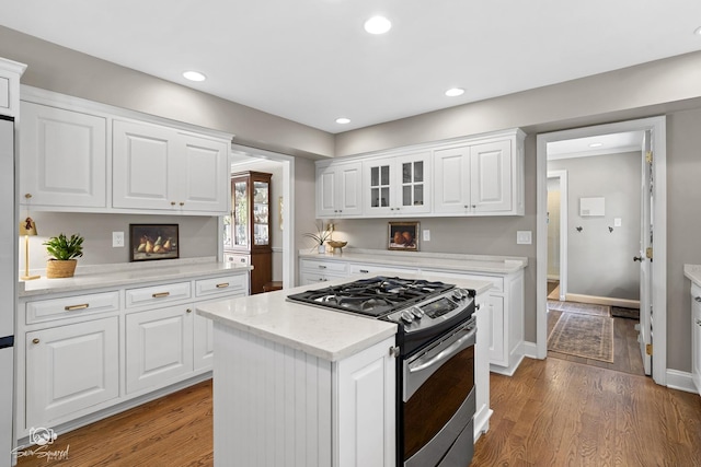 3302 Kingswood Ct, Joliet, IL 60431 - kitchen with stainless steel gas stove, light wood-type flooring, white cabinets, and recessed lighting