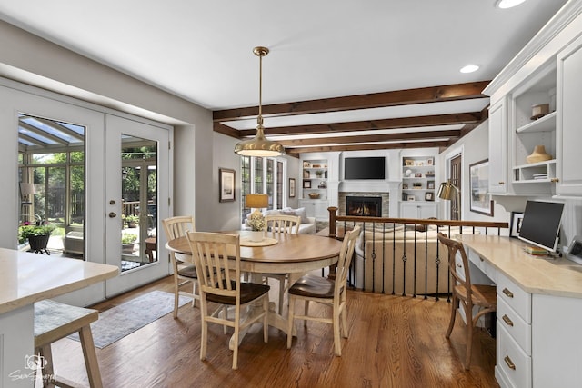 3302 Kingswood Ct, Joliet, IL 60431 - dining area featuring a warm lit fireplace, beamed ceiling, dark wood-style floors, recessed lighting, and french doors