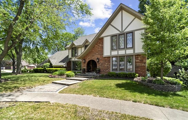 3302 Kingswood Ct, Joliet, IL 60431 - tudor-style house featuring brick siding, a front yard, and stucco siding