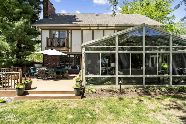 3302 Kingswood Ct, Joliet, IL 60431 - back of property featuring a chimney, stucco siding, roof with shingles, and a lawn