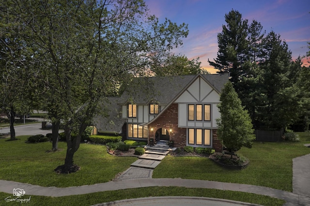 3302 Kingswood Ct, Joliet, IL 60431 - english style home with a lawn, stucco siding, and brick siding