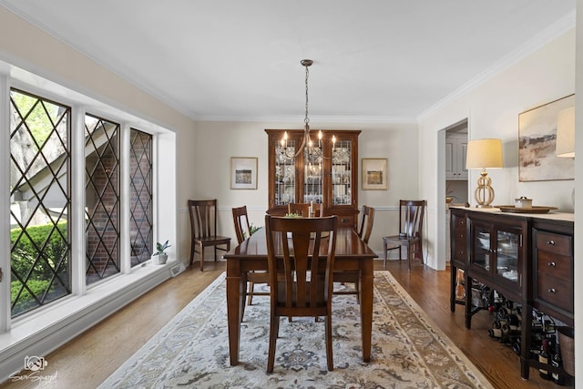3302 Kingswood Ct, Joliet, IL 60431 - dining space featuring a chandelier, ornamental molding, and wood finished floors
