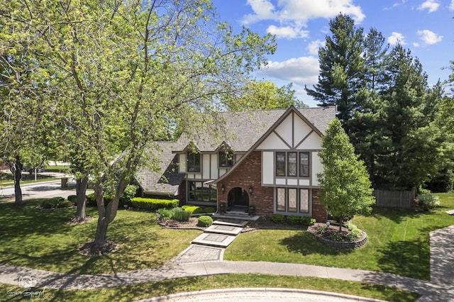 3302 Kingswood Ct, Joliet, IL 60431 - tudor house with stucco siding, a front lawn, and brick siding