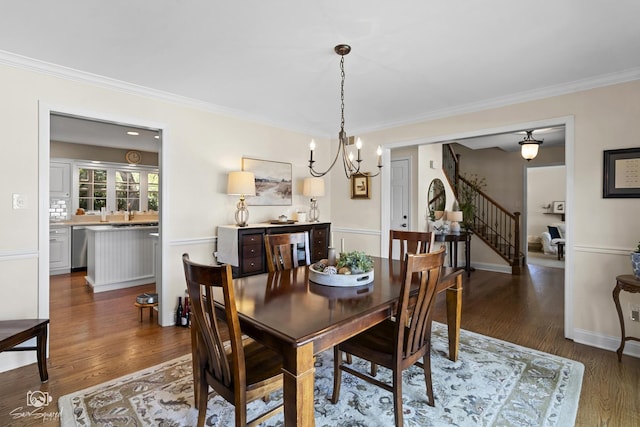 3302 Kingswood Ct, Joliet, IL 60431 - dining space with a chandelier, stairs, dark wood-style floors, crown molding, and baseboards