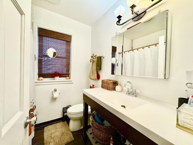 6228 N Artesian Ave, Chicago, IL 60659 - bathroom featuring vanity, toilet, tile patterned flooring, baseboards, and a shower with shower curtain