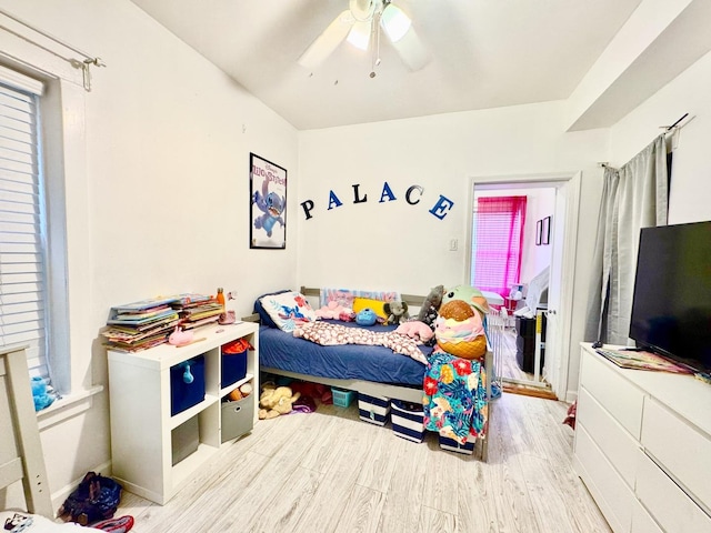 6228 N Artesian Ave, Chicago, IL 60659 - bedroom with wood finished floors, a ceiling fan, and multiple windows