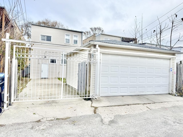 6228 N Artesian Ave, Chicago, IL 60659 - view of front of home with a fenced front yard, a garage, and a gate