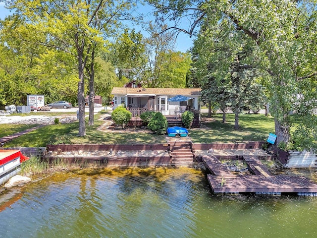 75 Largemouth Ln, Wilmington, IL 60481 - dock area with a boat ramp, a deck with water view, and a lawn