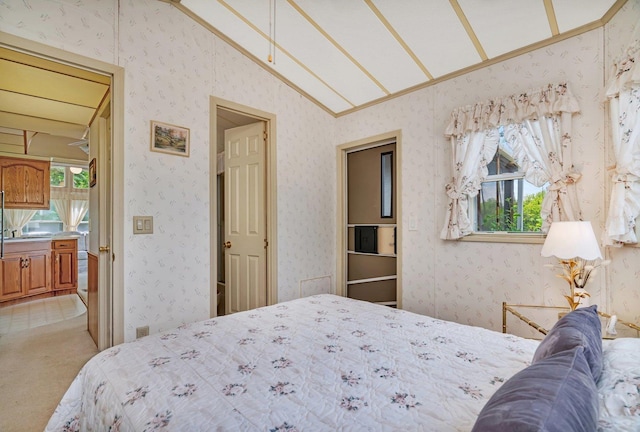 75 Largemouth Ln, Wilmington, IL 60481 - bedroom featuring vaulted ceiling, multiple windows, wallpapered walls, and light carpet