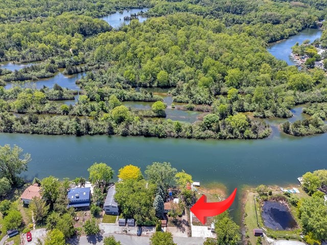 75 Largemouth Ln, Wilmington, IL 60481 - bird's eye view of a large body of water and a heavily wooded area