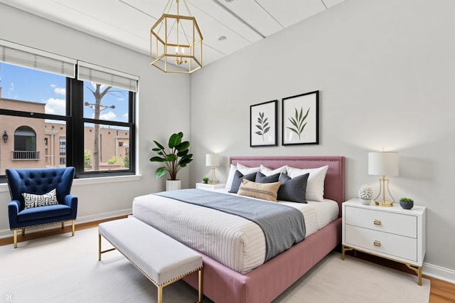 1301 W Washington Blvd Unit 305, Chicago, IL 60607 - bedroom featuring a chandelier and light wood finished floors