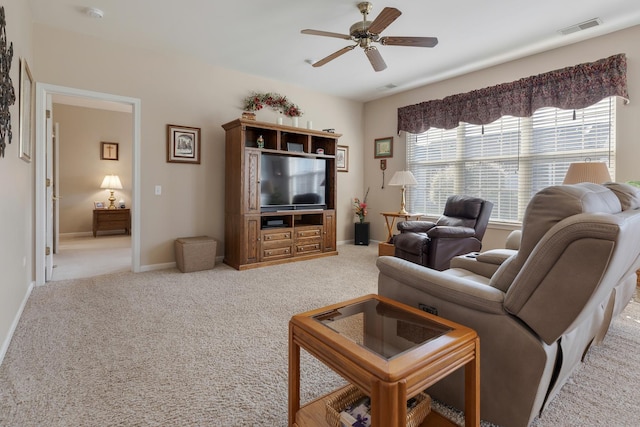 12183 Wildflower Ln, Huntley, IL 60142 - living area with ceiling fan, carpet, and baseboards
