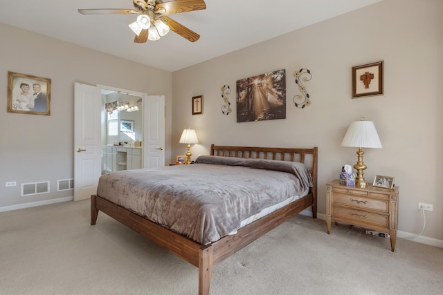 12183 Wildflower Ln, Huntley, IL 60142 - bedroom with light carpet, baseboards, ensuite bathroom, and ceiling fan