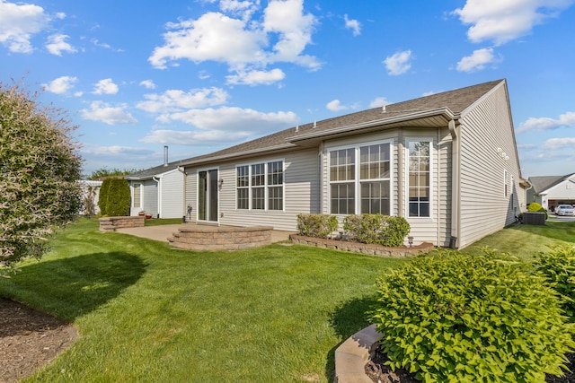 12183 Wildflower Ln, Huntley, IL 60142 - rear view of property featuring a patio area, a yard, and central AC unit