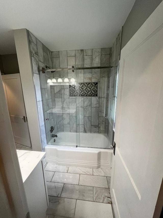 407 N William St, Joliet, IL 60435 - full bath with enclosed tub / shower combo, marble finish floors, and vanity