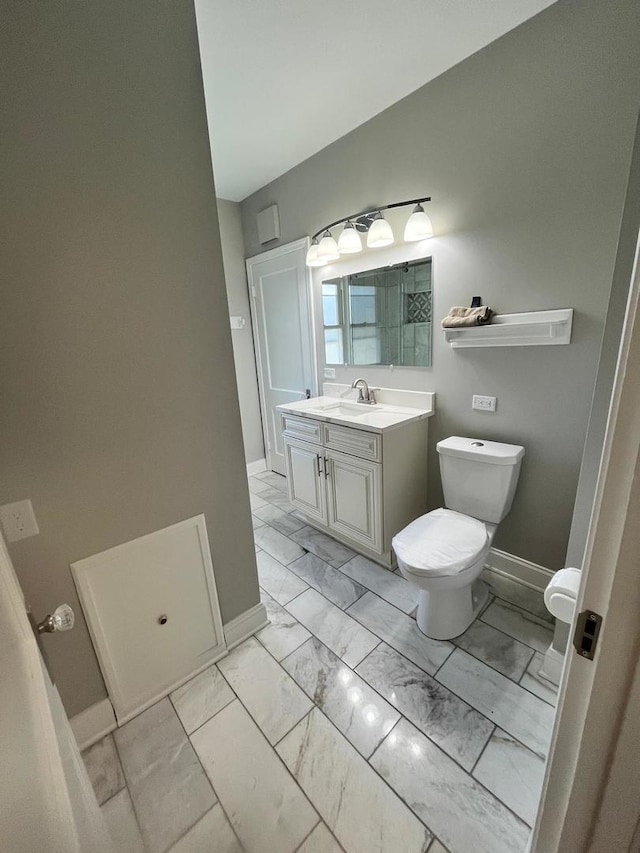 407 N William St, Joliet, IL 60435 - bathroom with marble finish floors, toilet, baseboards, and vanity