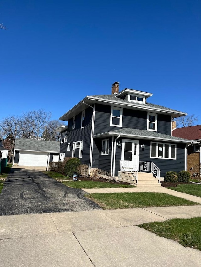 407 N William St, Joliet, IL 60435 - traditional style home featuring a chimney and a detached garage