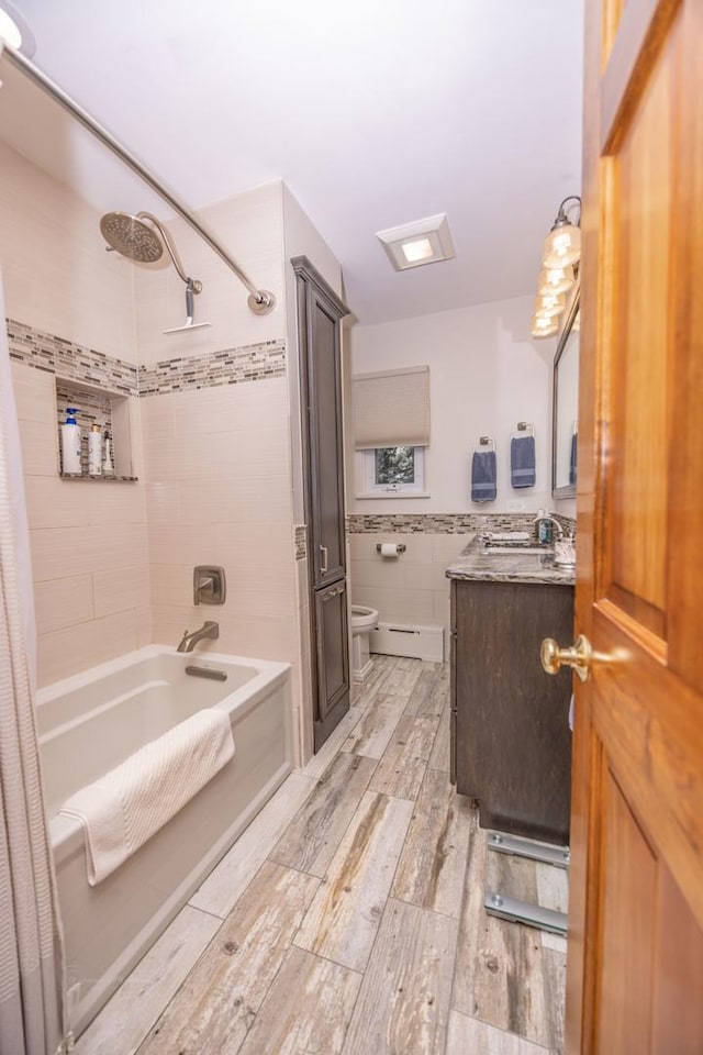 405 Farmington Ave, Joliet, IL 60435 - full bath with wood finished floors, toilet, tile walls, shower / bath combo with shower curtain, and vanity