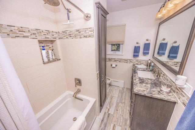 405 Farmington Ave, Joliet, IL 60435 - full bathroom featuring tile walls, shower / bath combination with curtain, vanity, toilet, and wainscoting