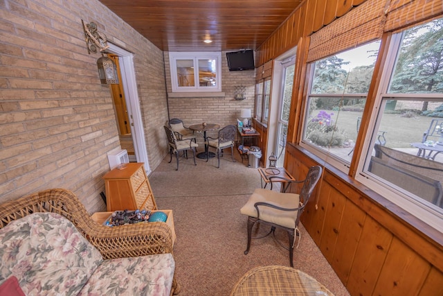 405 Farmington Ave, Joliet, IL 60435 - sunroom with brick wall, carpet flooring, and wood ceiling