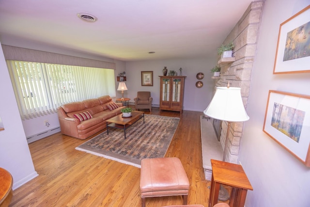 405 Farmington Ave, Joliet, IL 60435 - living area featuring a baseboard radiator and wood finished floors