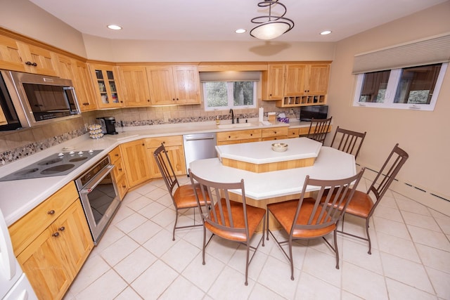 405 Farmington Ave, Joliet, IL 60435 - kitchen featuring appliances with stainless steel finishes, backsplash, light countertops, glass insert cabinets, and recessed lighting