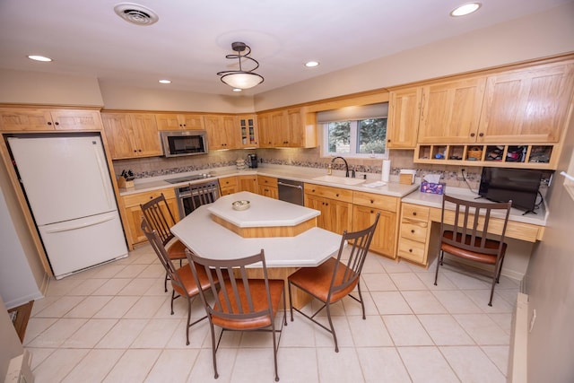 405 Farmington Ave, Joliet, IL 60435 - kitchen with appliances with stainless steel finishes, a sink, backsplash, light countertops, and glass insert cabinets
