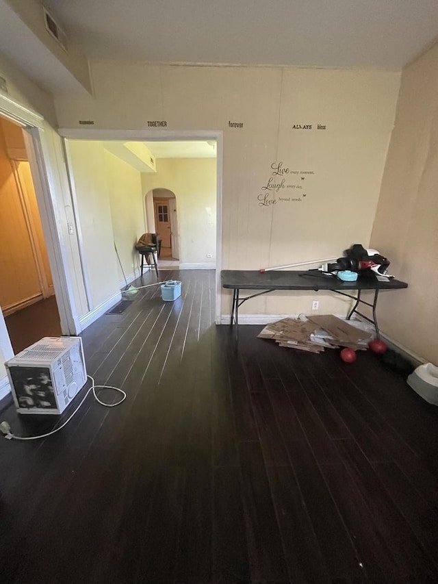 6824 S King St, Chicago, IL 60637 - hallway with arched walkways, wood finished floors, and baseboards