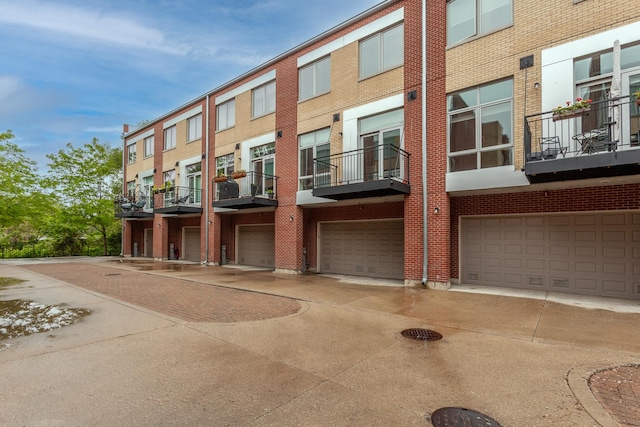 2823 N Oakley Ave Unit K, Chicago, IL 60618 - view of building exterior with a garage and driveway