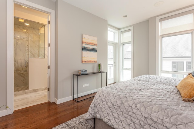 2823 N Oakley Ave Unit K, Chicago, IL 60618 - bedroom featuring wood finished floors, baseboards, and ensuite bathroom