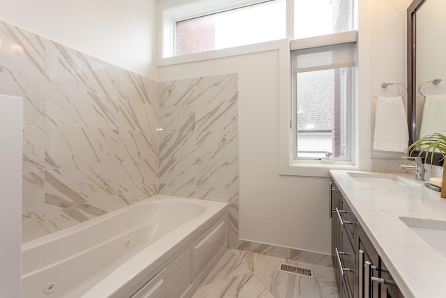 2823 N Oakley Ave Unit K, Chicago, IL 60618 - full bathroom featuring marble look tile flooring, healthy amount of natural light, a tub with jets, and double vanity
