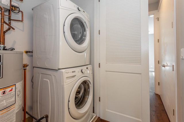 2823 N Oakley Ave Unit K, Chicago, IL 60618 - laundry area featuring stacked washer / drying machine, water heater, and wood finished floors