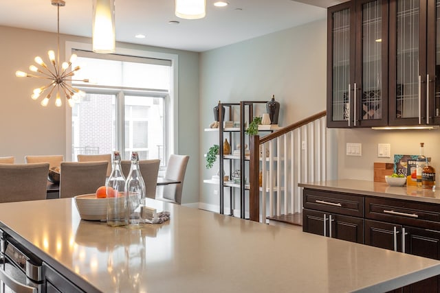 2823 N Oakley Ave Unit K, Chicago, IL 60618 - dining area featuring a chandelier, recessed lighting, and stairway