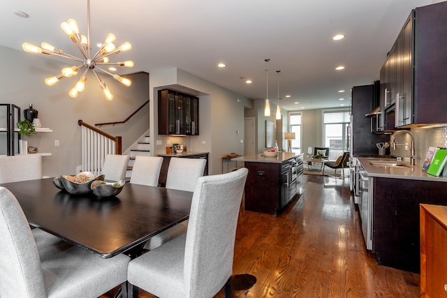 2823 N Oakley Ave Unit K, Chicago, IL 60618 - dining area with dark wood-style flooring, stairway, a chandelier, and recessed lighting