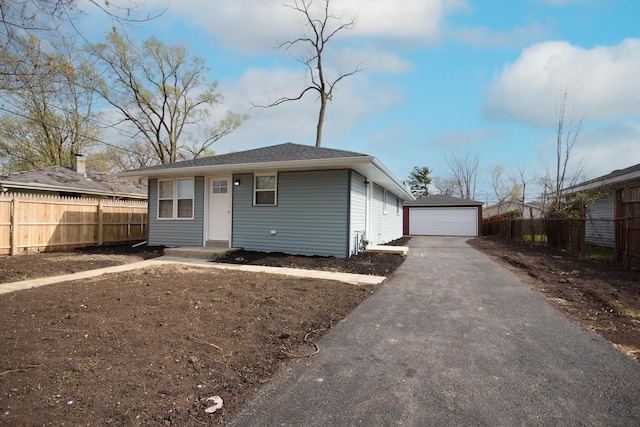 34 W 142nd St, Harvey, IL 60426 - view of front of home with a detached garage and an outbuilding