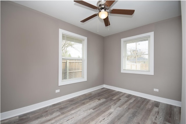 34 W 142nd St, Harvey, IL 60426 - unfurnished room with healthy amount of natural light, wood finished floors, and baseboards