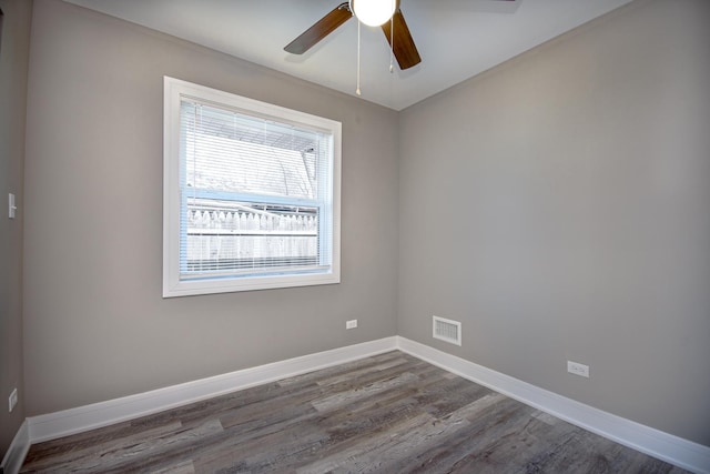 34 W 142nd St, Harvey, IL 60426 - unfurnished room featuring wood finished floors, ceiling fan, and baseboards