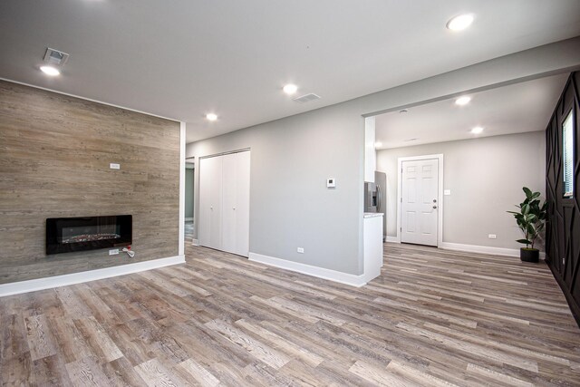 34 W 142nd St, Harvey, IL 60426 - unfurnished living room with wood finished floors, baseboards, a large fireplace, and recessed lighting